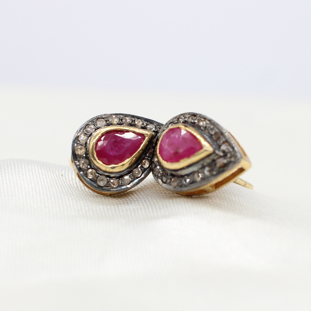 RUBY & DIAMOND EAR STUDS.