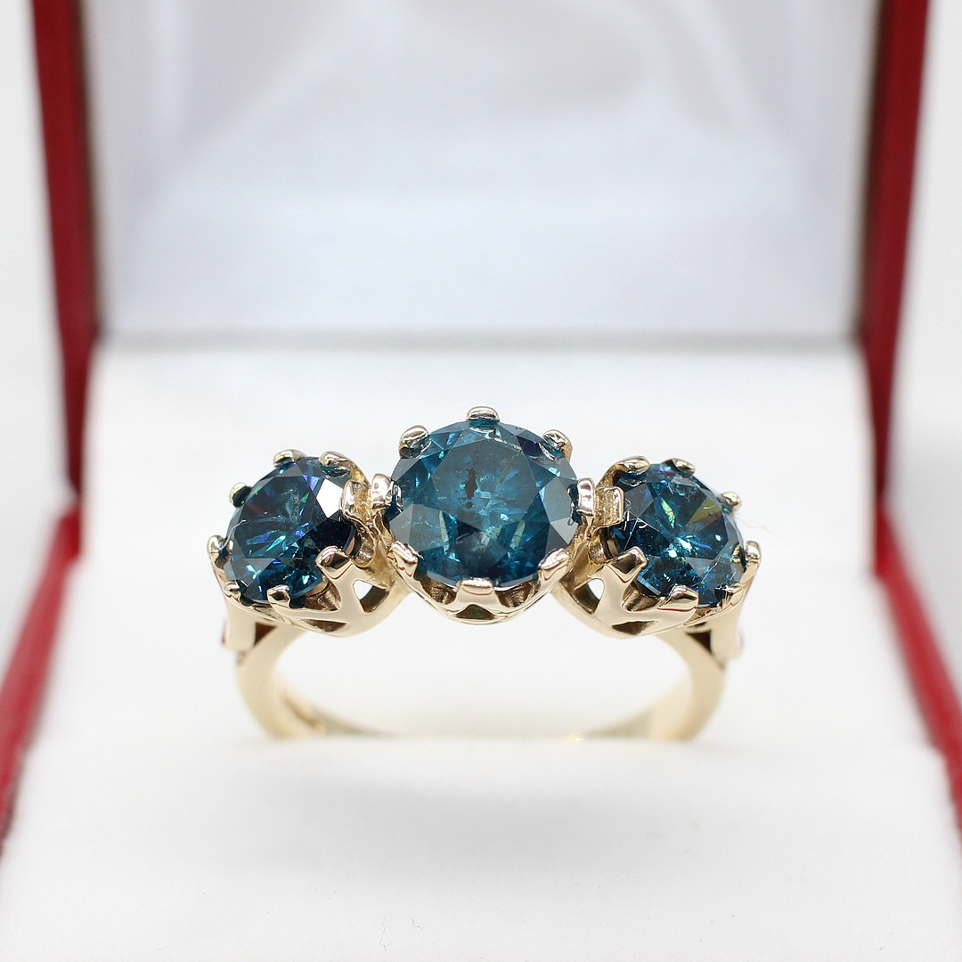 4.00CT FANCY BLUE DIAMOND TRILOGY RING.