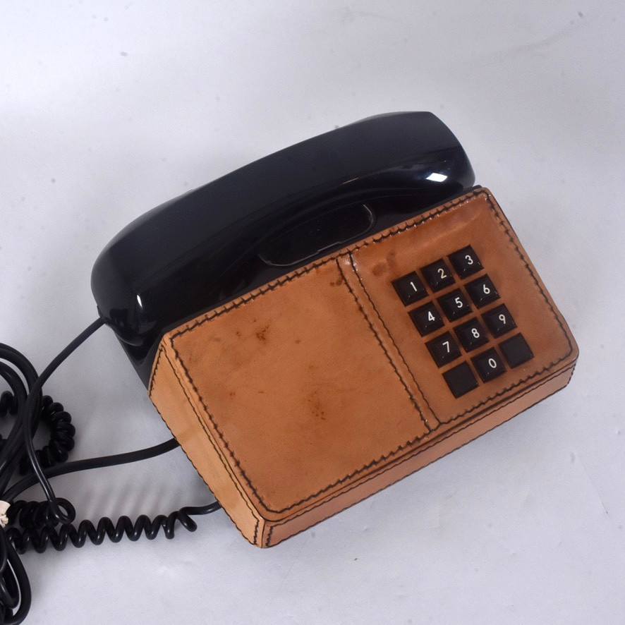 CARL ARNE BREGER. Knapptelefon, "Diavox", läderhölje,LM Ericsson. 1970/80-tal.