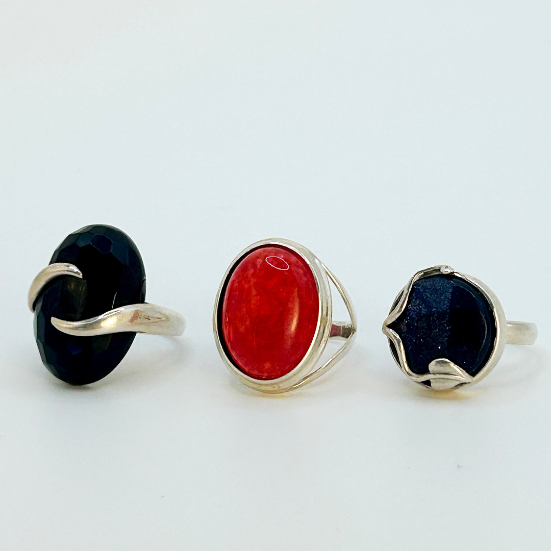 THREE SILVER STONE SET RINGS.