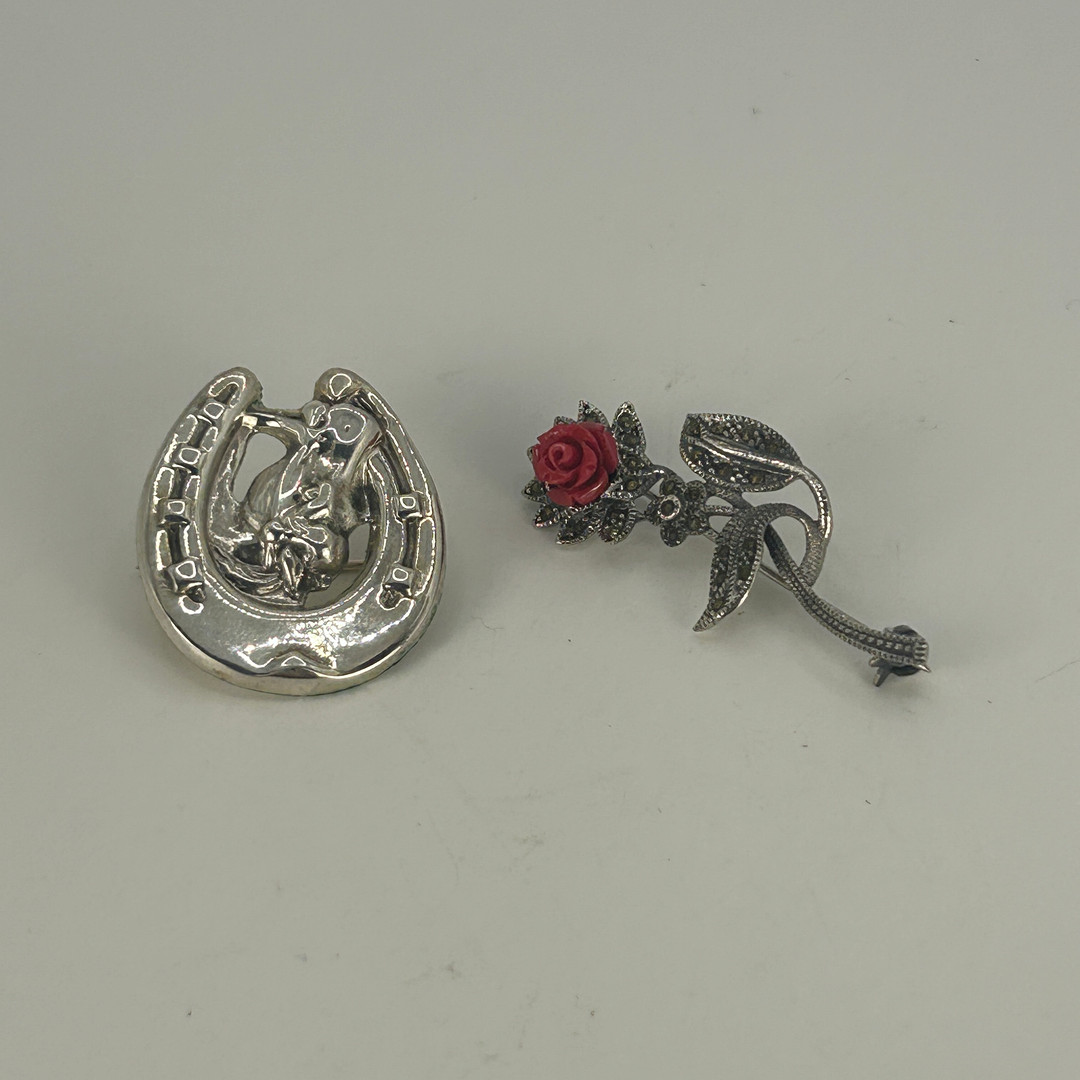 TWO SILVER BROOCHES.