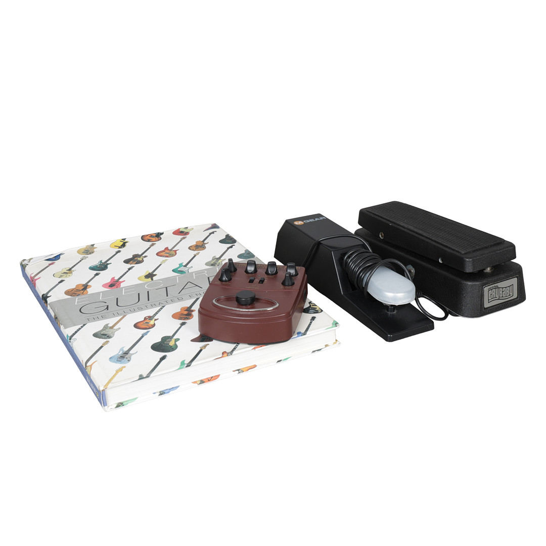 TWO GUITAR PEDALS, A KEYBOARD SUSTAIN PEDAL AND AN ELECTRIC GUITAR ENCYCLOPEDIA (4).