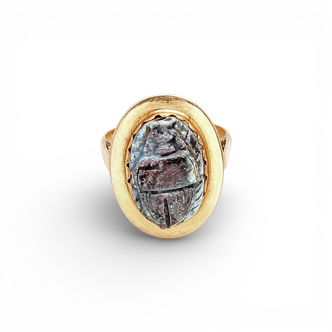 Gold ring with Egyptian scarab.