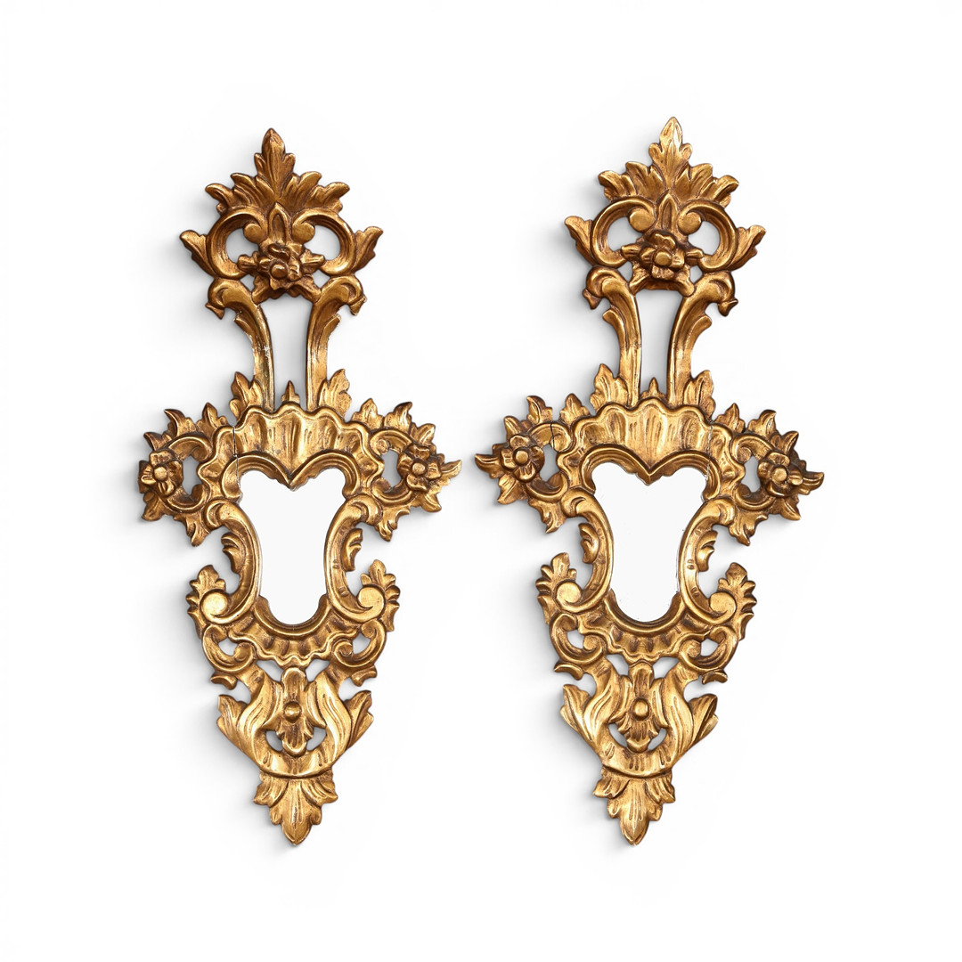 Pair of 18th Century-like ornamental mirrors in stuccoed and gilt wood, early 20th Century.