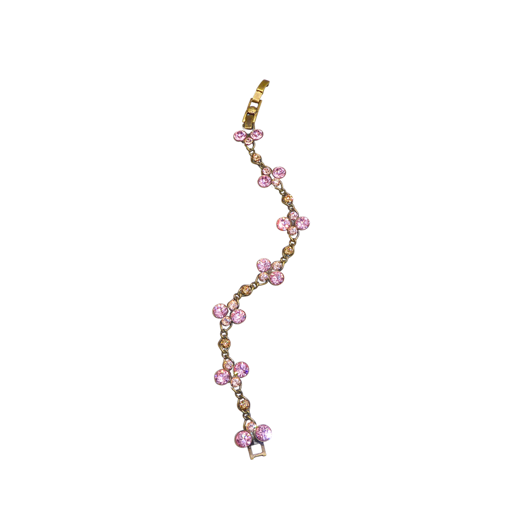 KONPLOTT GLIEDERARMBAND IM FLORALEN STIL MIT STRASSBESATZ.