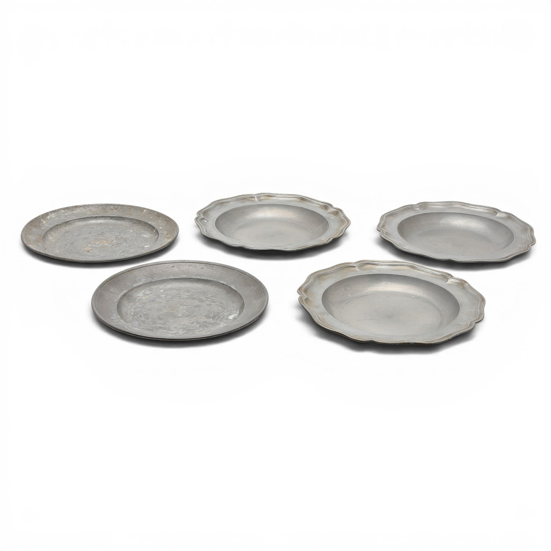 Set of three mitred dishes and a pair of German pewter dishes, 18th and 19th centuries.