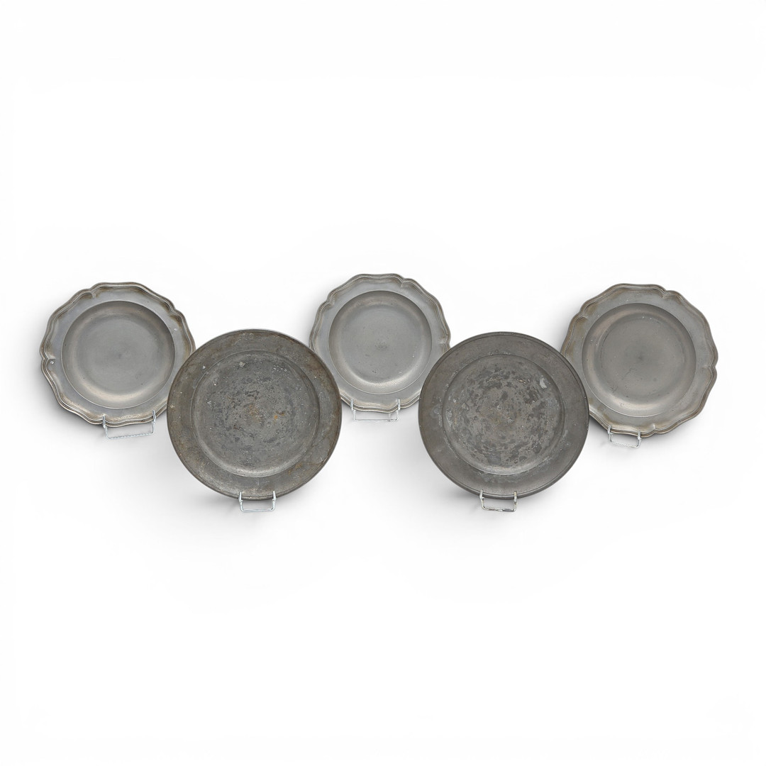 Set of three mitred dishes and a pair of German pewter dishes, 18th and 19th centuries.