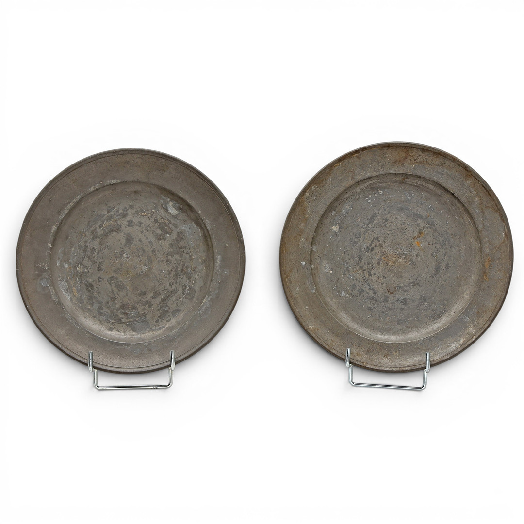 Set of three mitred dishes and a pair of German pewter dishes, 18th and 19th centuries.