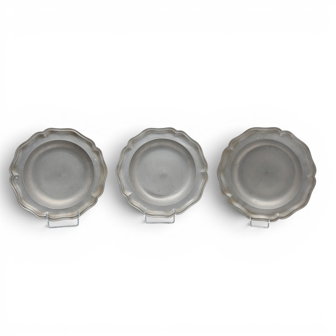 Set of three mitred dishes and a pair of German pewter dishes, 18th and 19th centuries.
