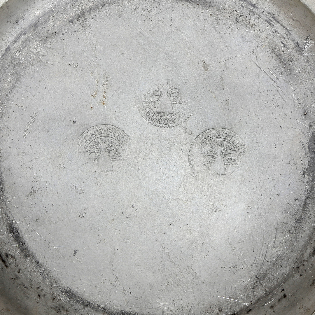 Set of three mitred dishes and a pair of German pewter dishes, 18th and 19th centuries.