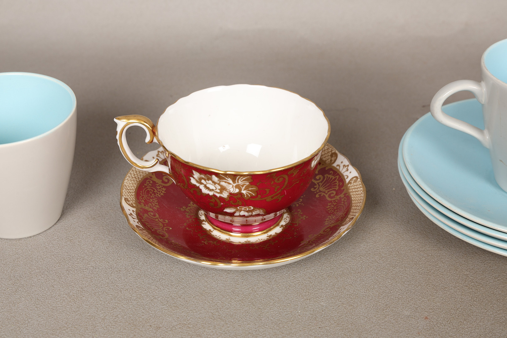 FOUR POOLE POTTERY 'TWINTONE' CUPS AND SAUCERS AND A CROWN STAFFORDSHIRE TEA CUP AND SAUCER (10).