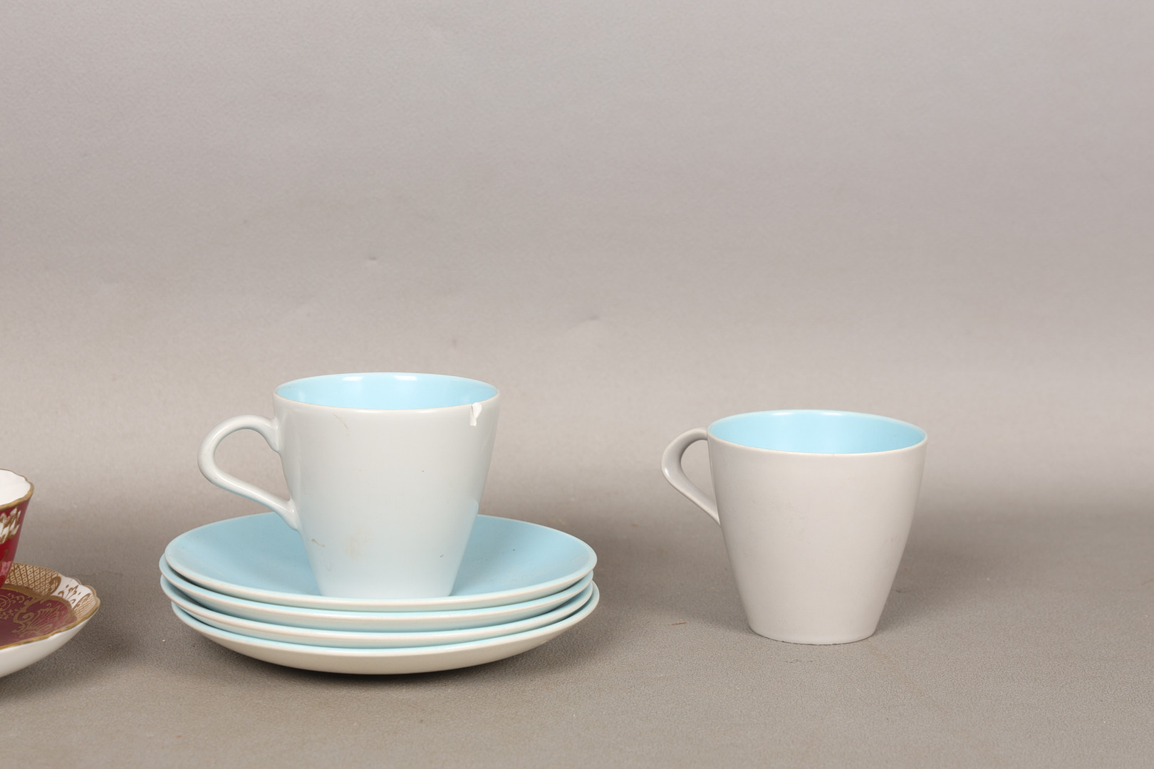 FOUR POOLE POTTERY 'TWINTONE' CUPS AND SAUCERS AND A CROWN STAFFORDSHIRE TEA CUP AND SAUCER (10).