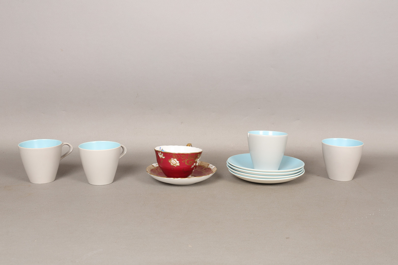 FOUR POOLE POTTERY 'TWINTONE' CUPS AND SAUCERS AND A CROWN STAFFORDSHIRE TEA CUP AND SAUCER (10).