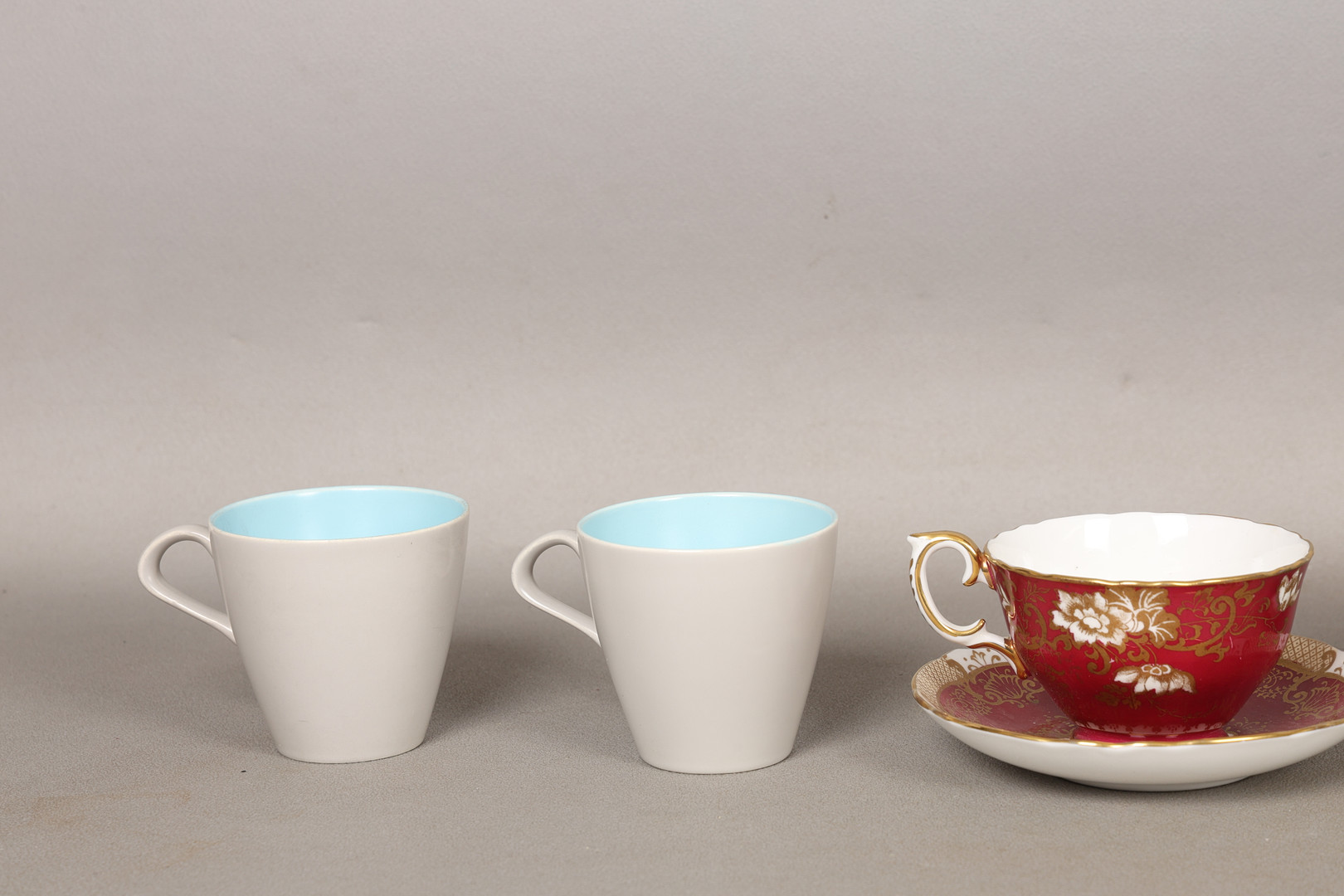 FOUR POOLE POTTERY 'TWINTONE' CUPS AND SAUCERS AND A CROWN STAFFORDSHIRE TEA CUP AND SAUCER (10).