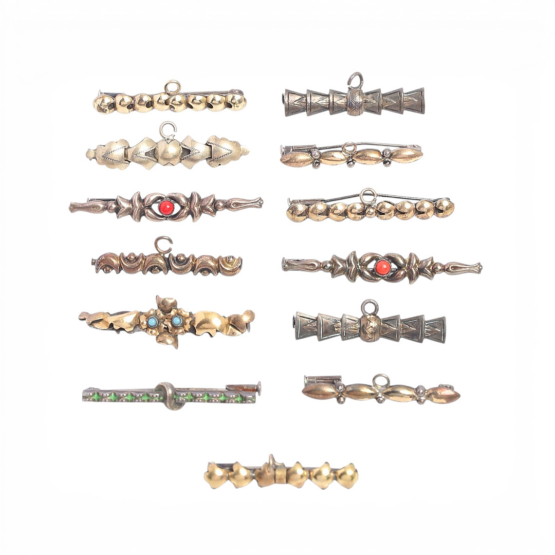 Thirteen silver baptism or communion brooches/pins, first half of the 20th Century.