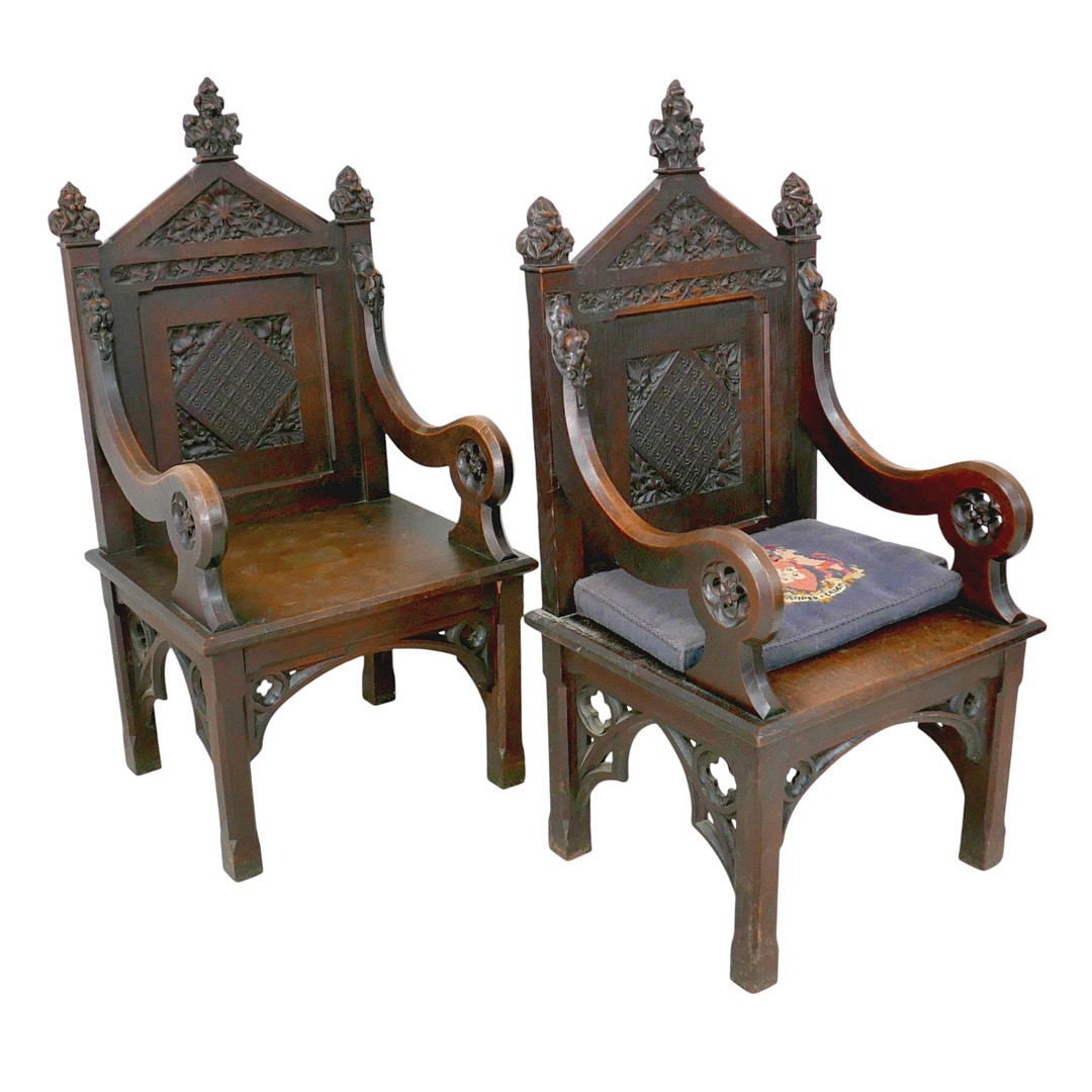 A PAIR OF VICTORIAN GOTHIC OAK CHURCH CHAIRS WITH PROVENANCE.