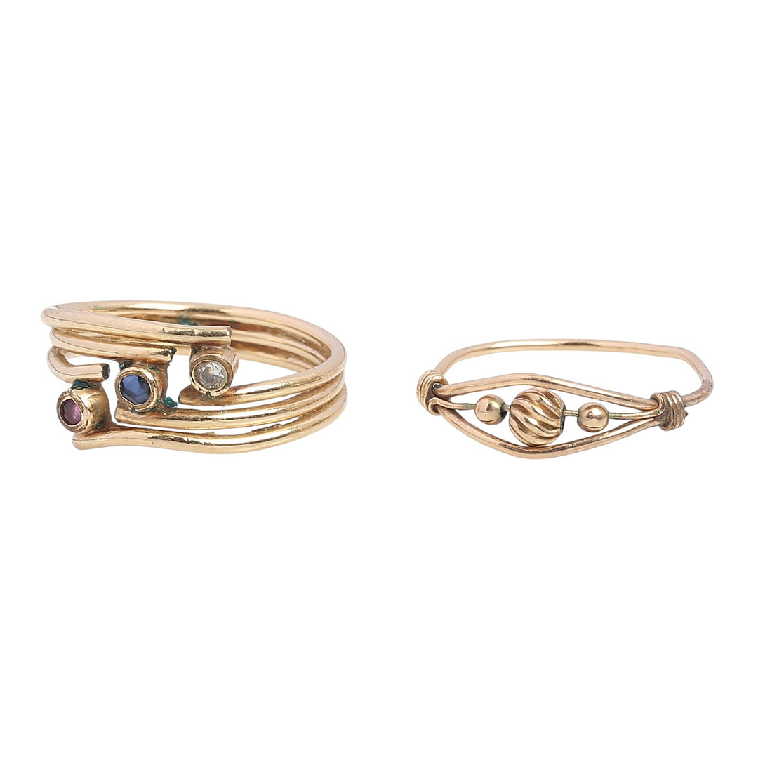 Two over-gilded metal rings.