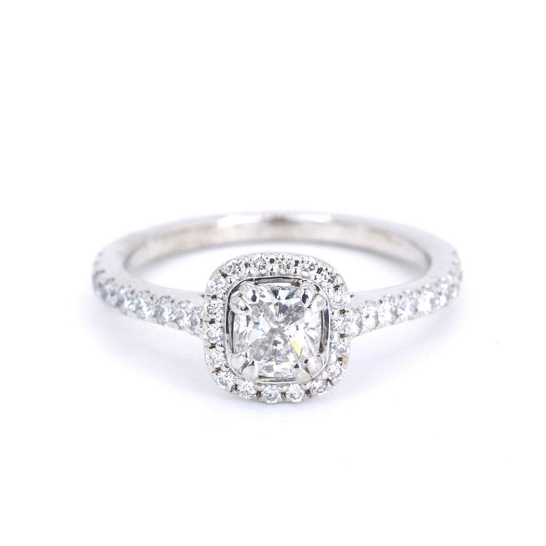 0.9 CT DIAMOND HALO RING.