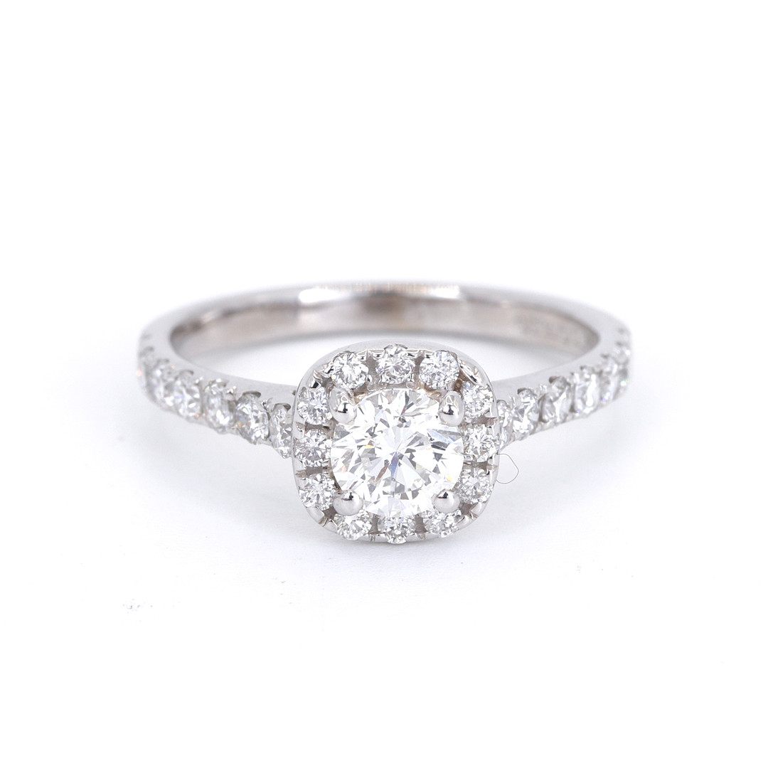 18CT WHITE GOLD 1.04CT DIAMOND SET HALO RING.