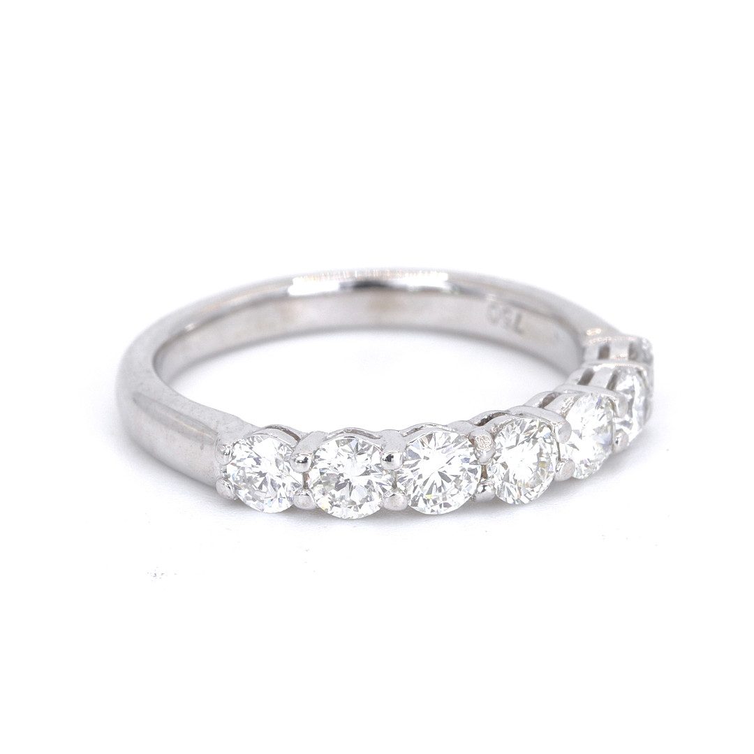 18CT 0.95CT DIAMOND HALF ETERNITY RING.