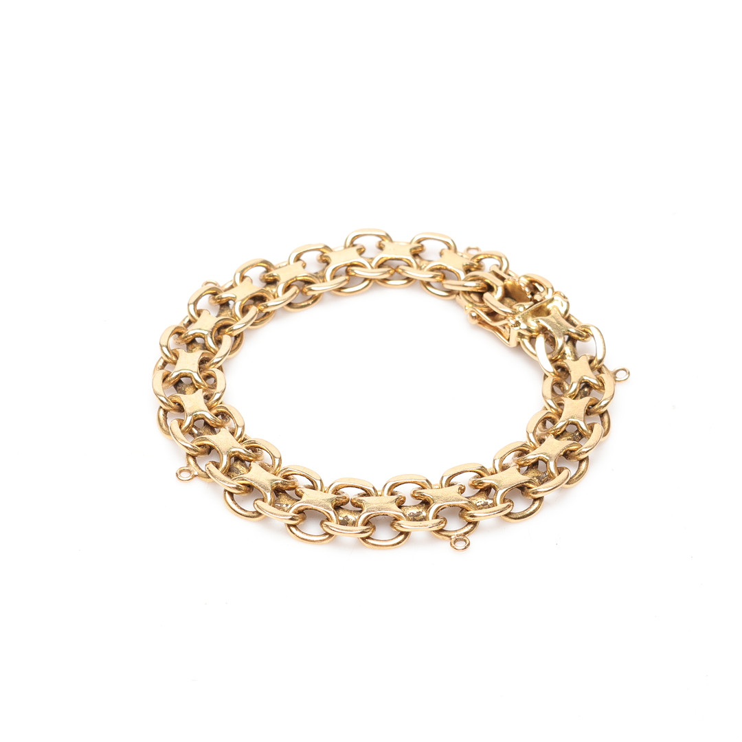 ARMBAND, ''x-länk'' 18k guld vikt ca 35,3g.