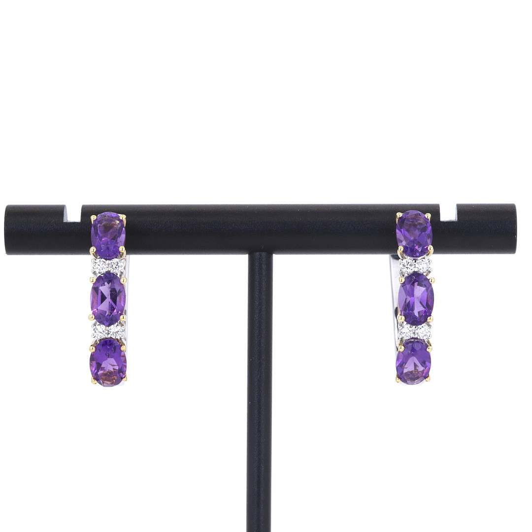 18CT AMETHYST & DIAMOND SET RING.