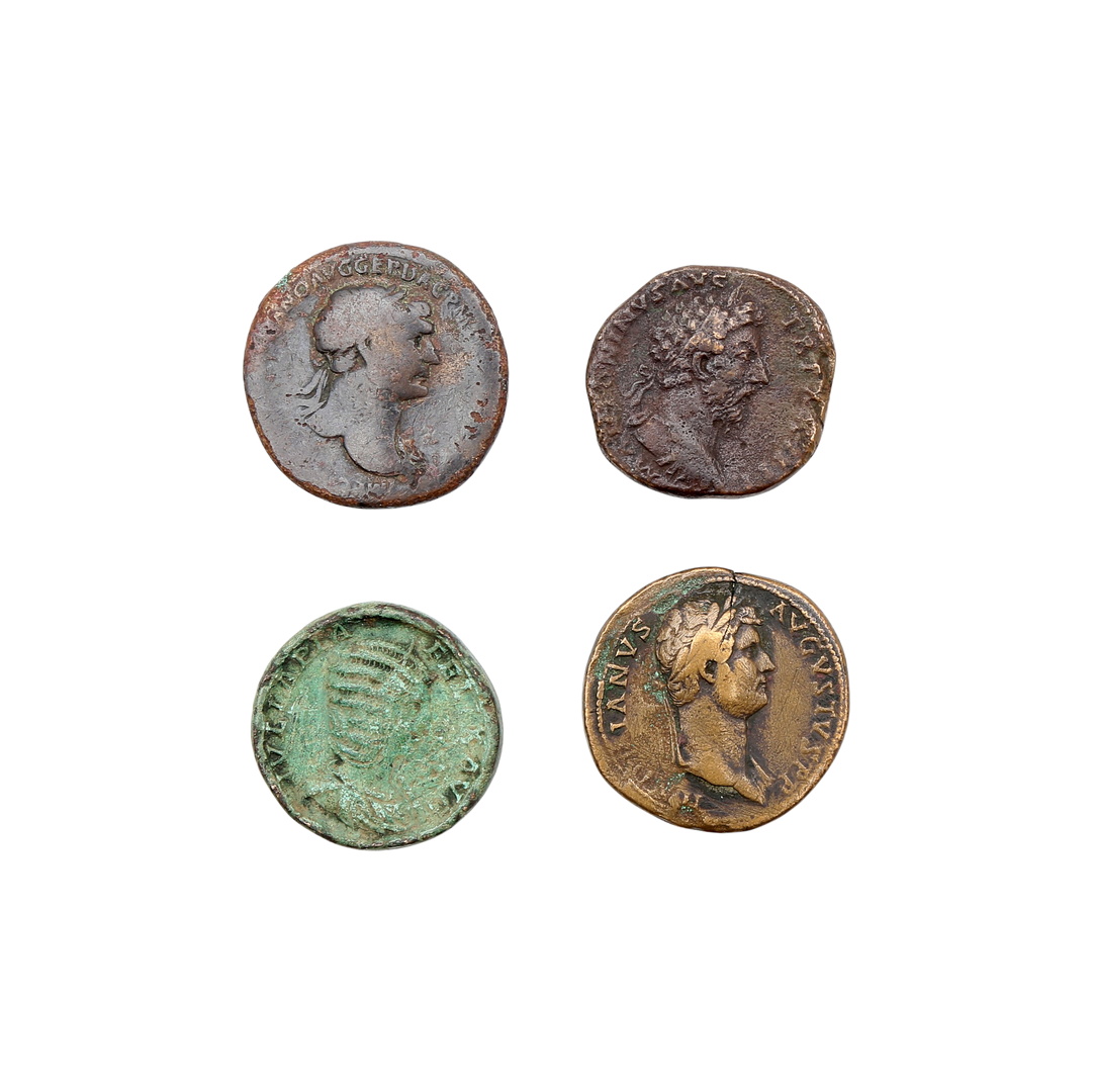Four Roman coins in copper and bronze, 1st to 3rd century AD.