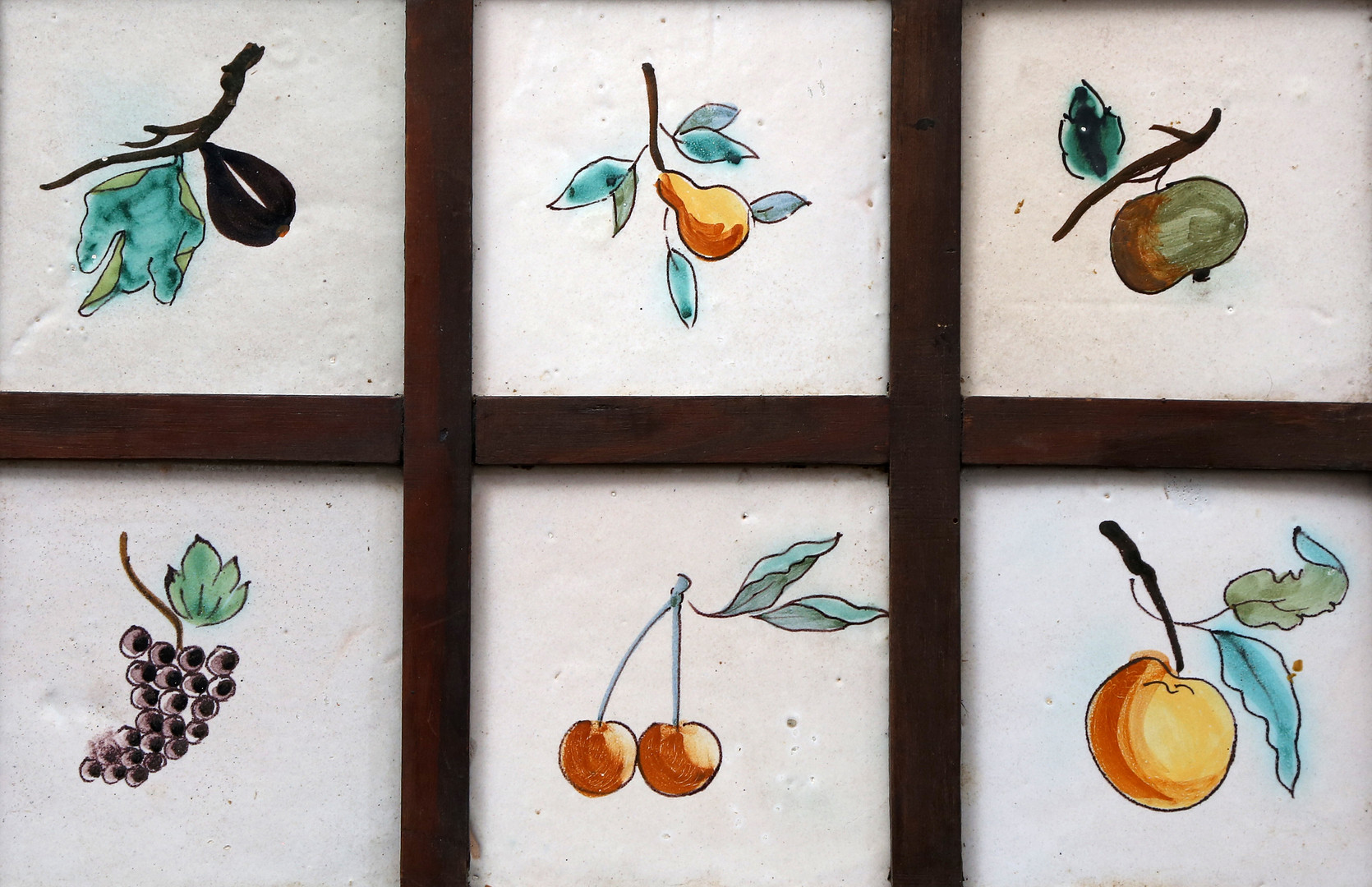 Panel with six Catalan fruit-decorated tiles, 19th Century.