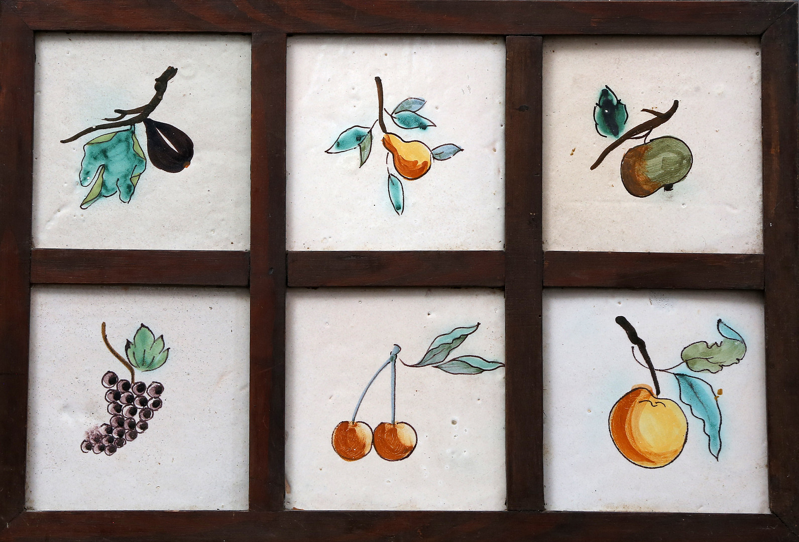 Panel with six Catalan fruit-decorated tiles, 19th Century.