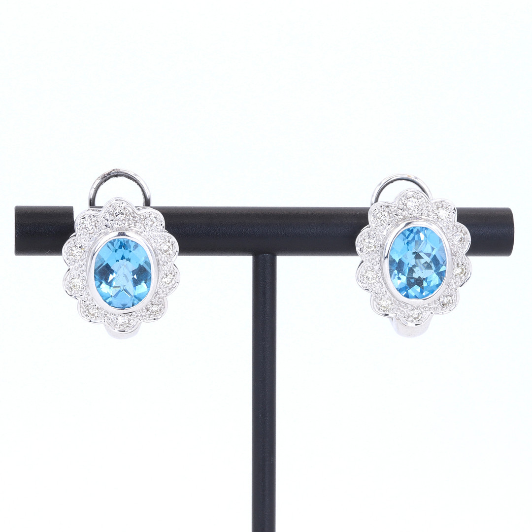 18CT BLUE TOPAZ & DIAMOND EARRINGS.