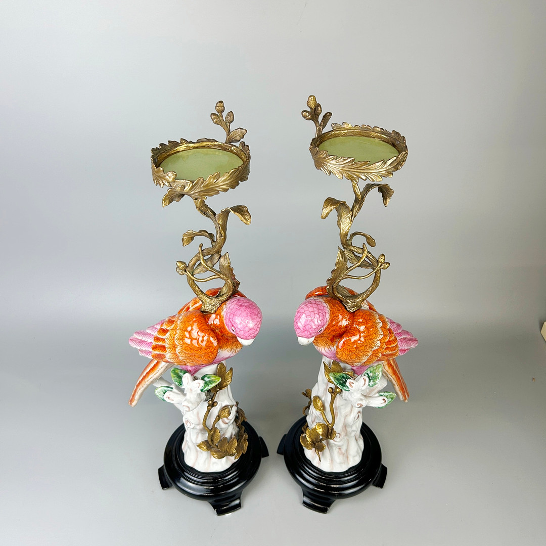 PORCELAIN PARROT CANDLESTICKS.