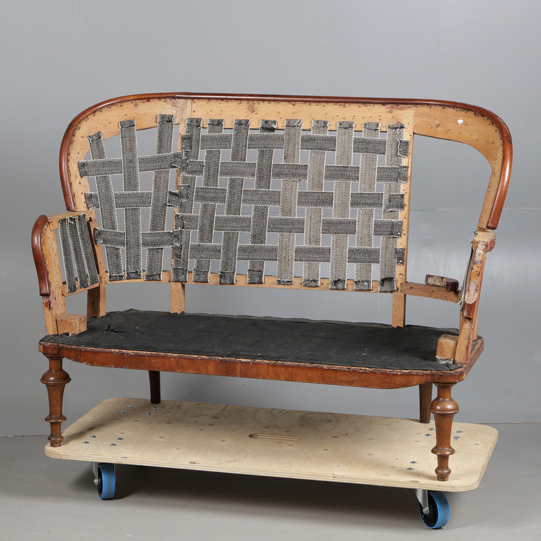 A VICTORIAN SALON SETTEE FRAME.