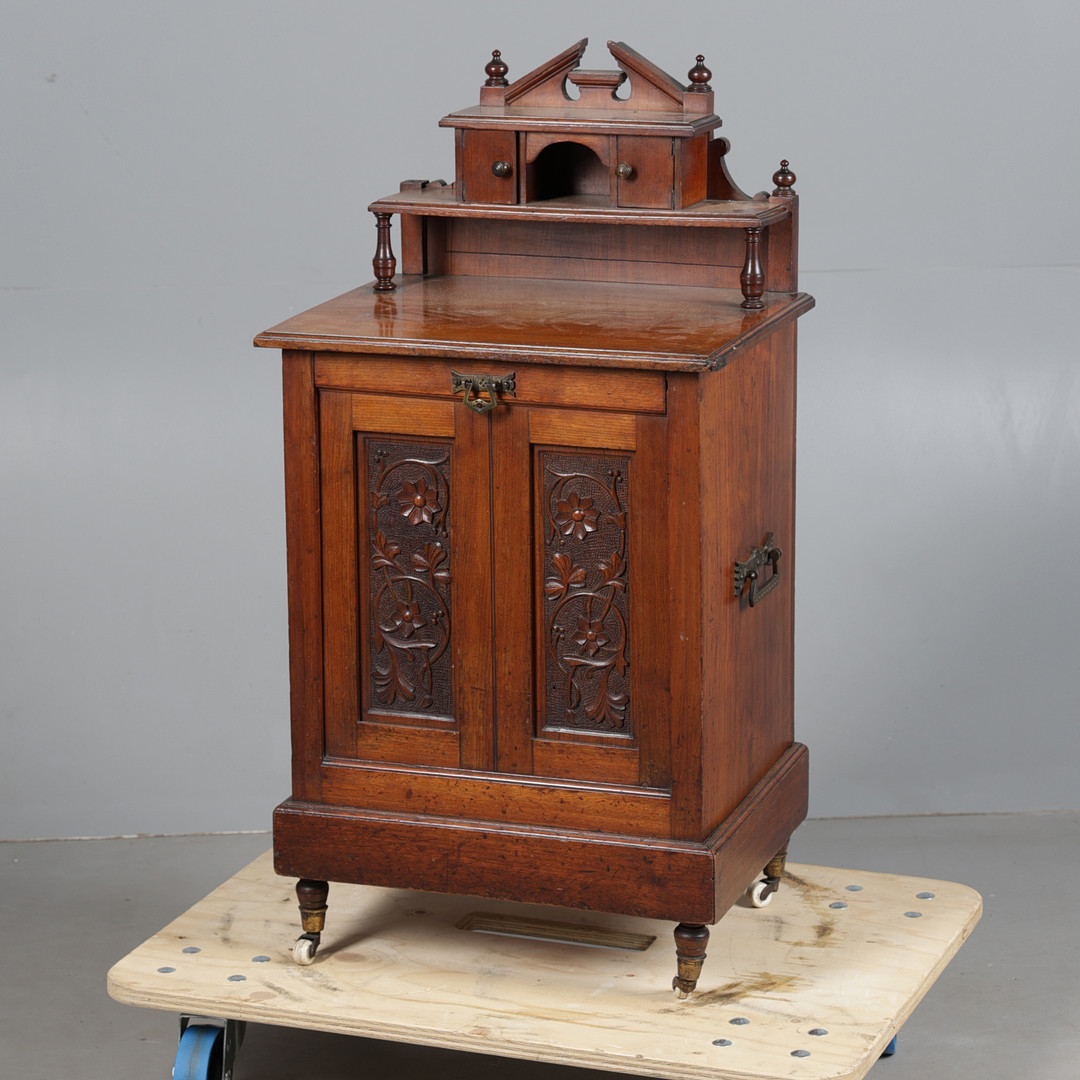 A LATE VICTORIAN WALNUT COAL PURDONIUM.