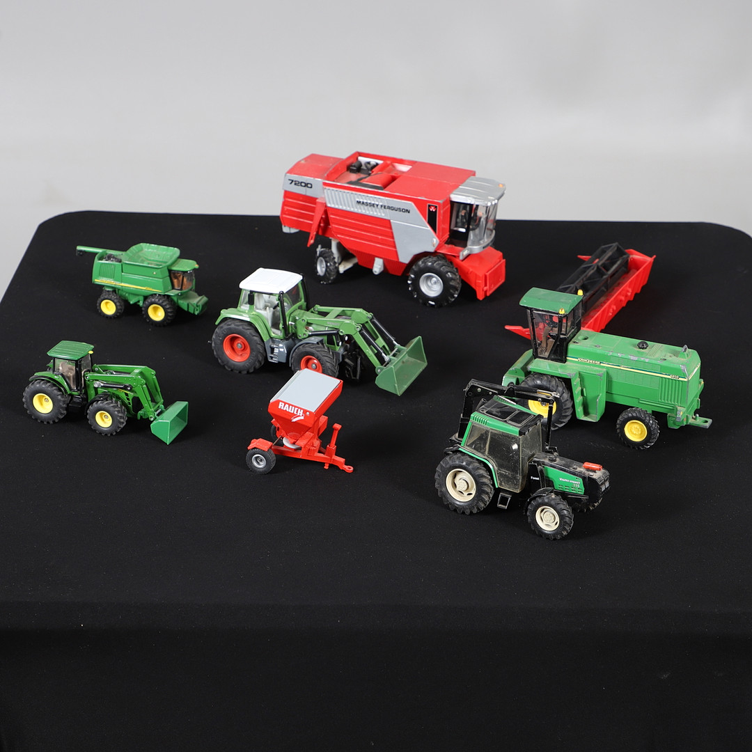 GROUP OF SEVEN DIE CAST AGRICULTURAL VEHICLES.