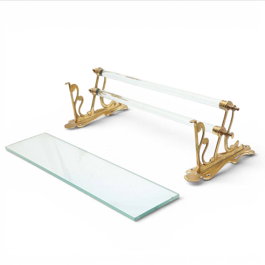 Modernist bathroom set comprising a towel rail and a glass and brass shelf, early 20th Century.