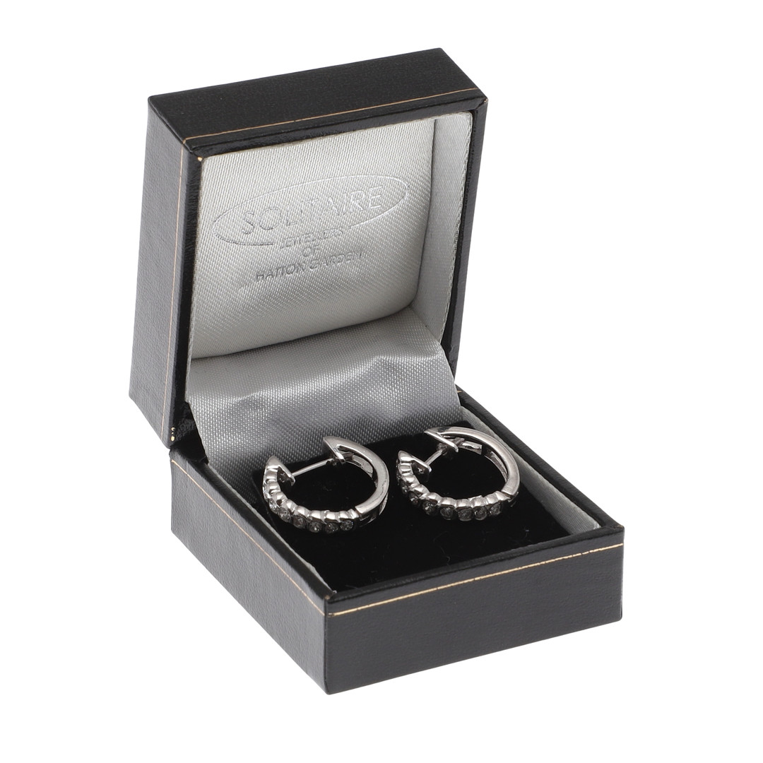 A PAIR OF DIAMOND HOOP EARRINGS.