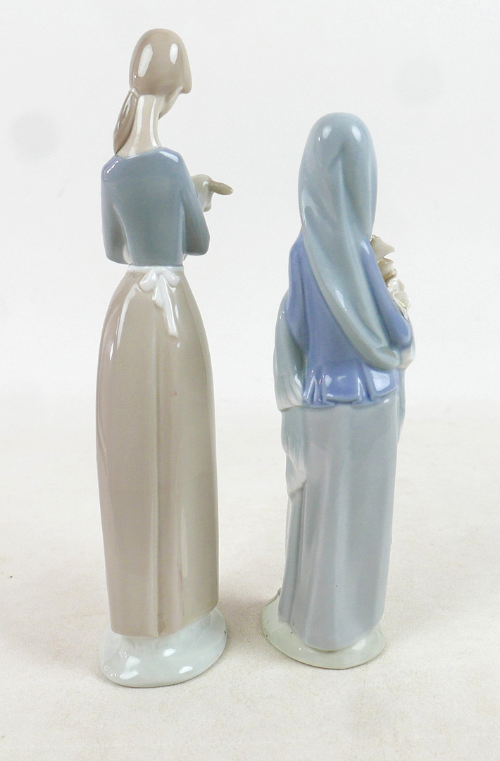 FIVE ROYAL DOULTON AND LLADRO FIGURINES.