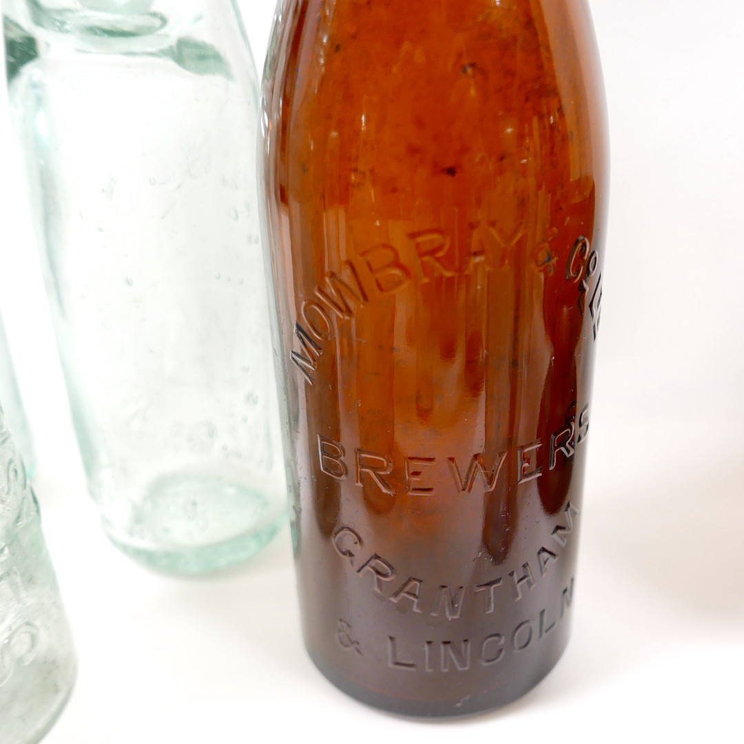 THIRTY-SIX VINTAGE GLASS BOTTLES AND CONTAINERS.