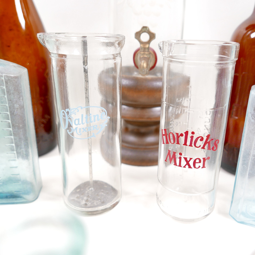 THIRTY-SIX VINTAGE GLASS BOTTLES AND CONTAINERS.