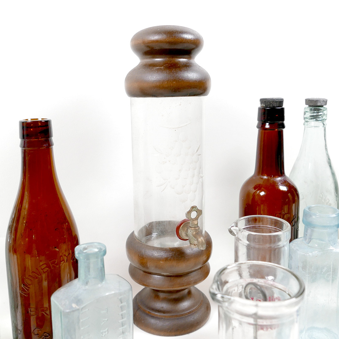 THIRTY-SIX VINTAGE GLASS BOTTLES AND CONTAINERS.