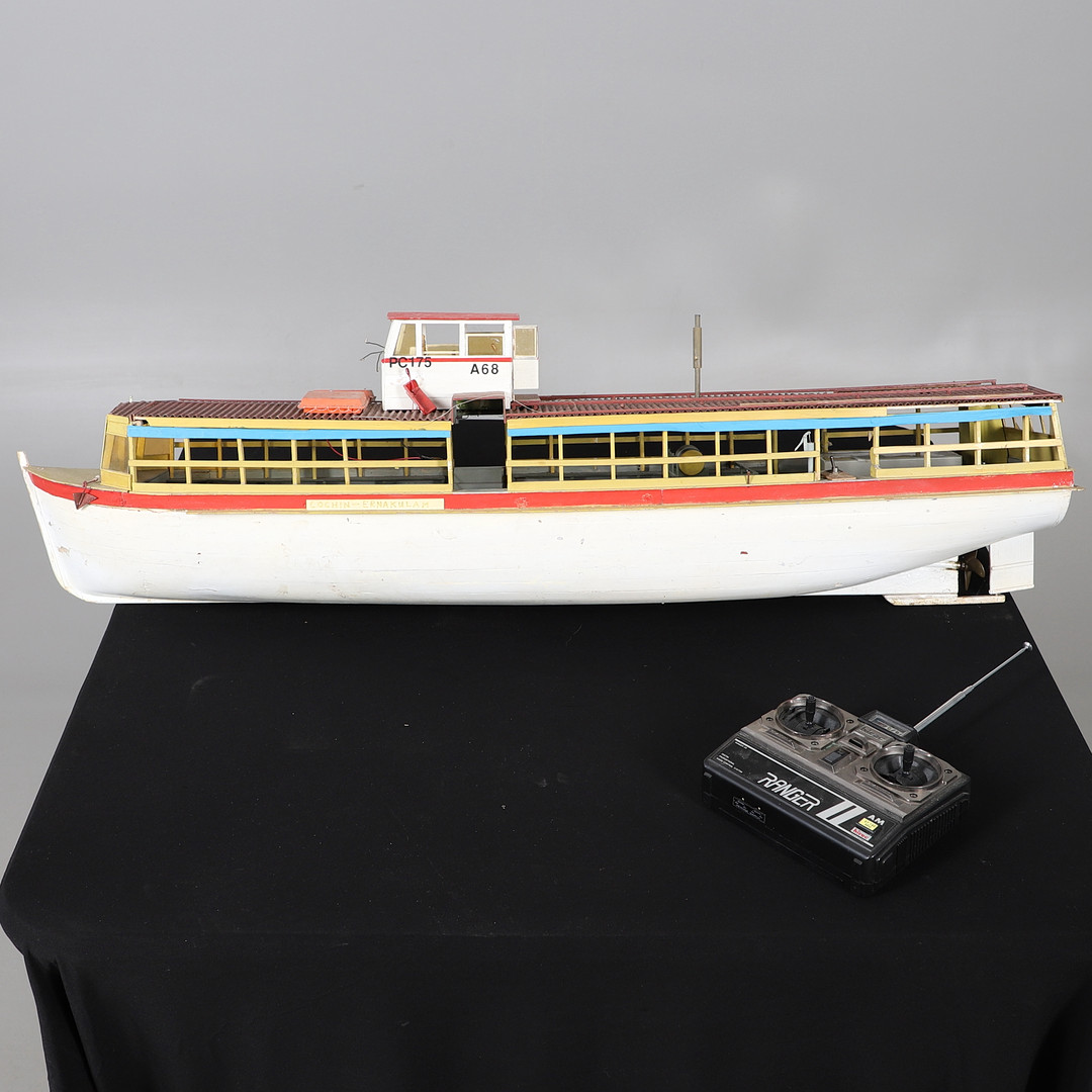 A SCRATCH-BUILT REMOTE CONTROLLED RIVER CRUISE BOAT.
