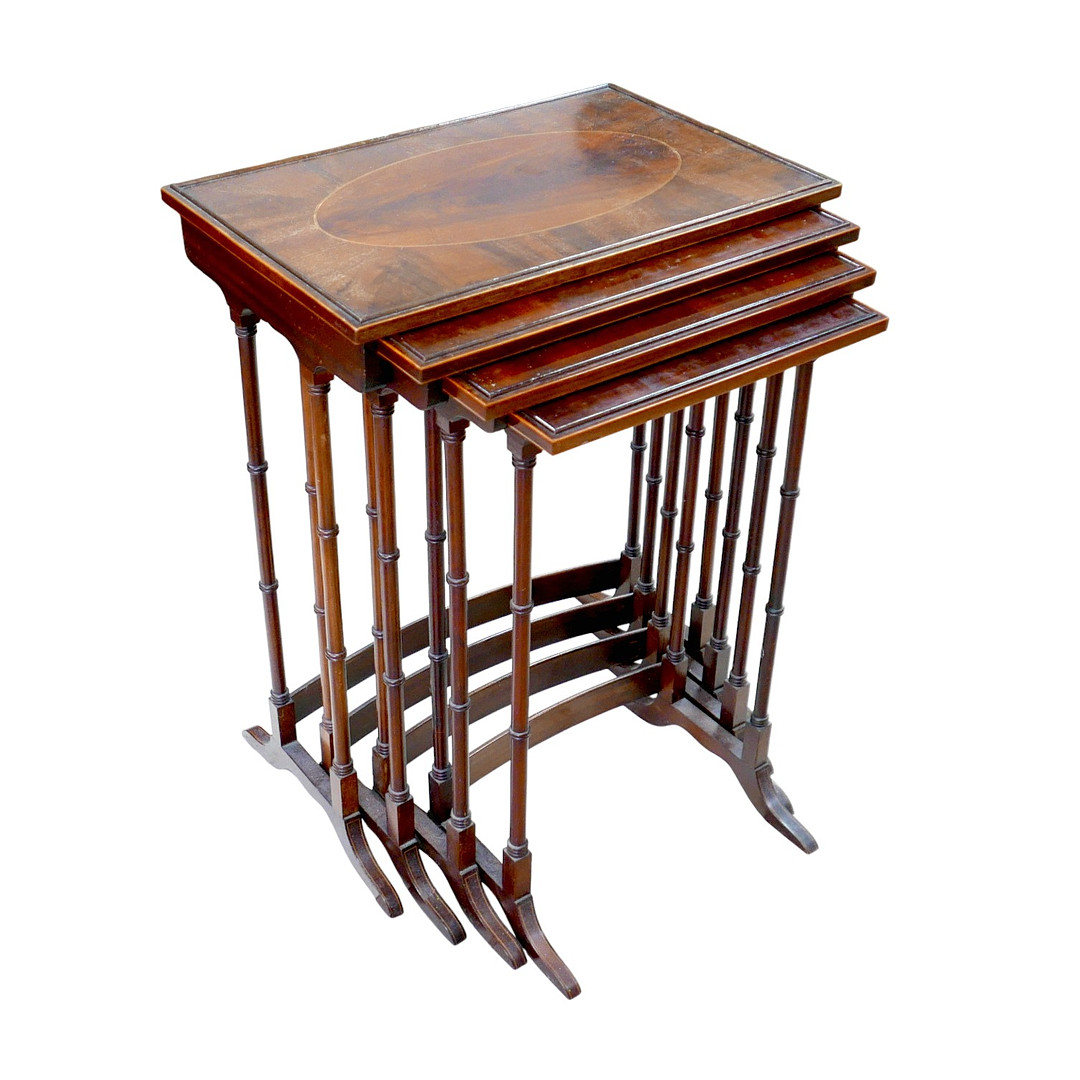 A NEST OF FOUR MAHOGANY TABLES.