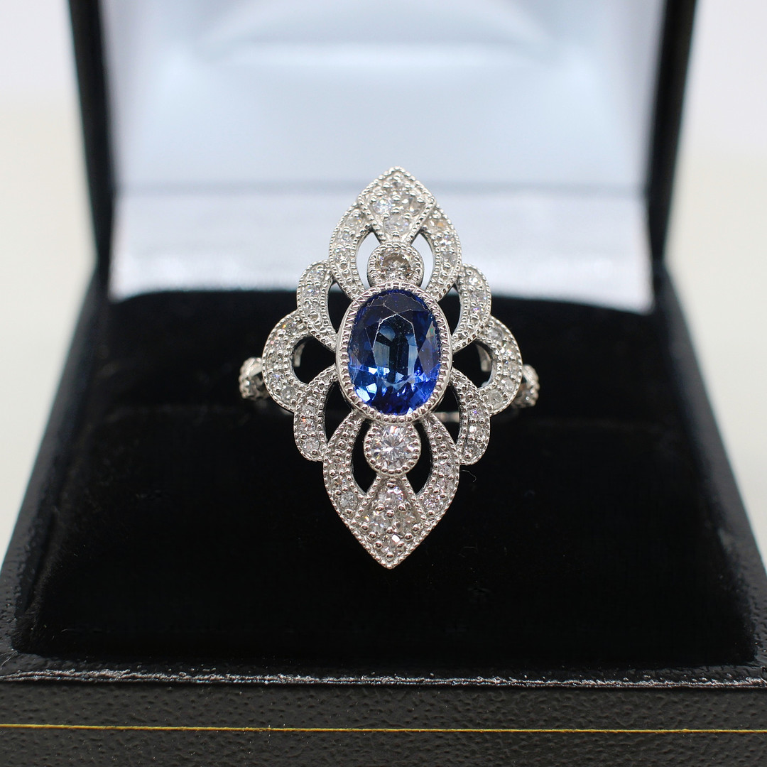 SAPPHIRE & DIAMOND MARQUISE SHAPED RING.