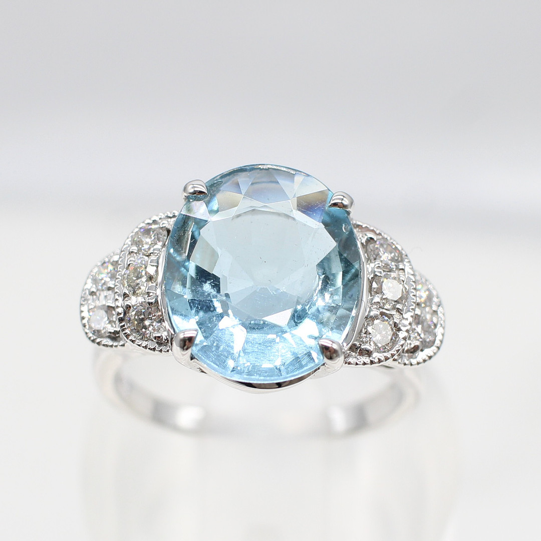 LARGE AQUAMARINE & DIAMOND RING.