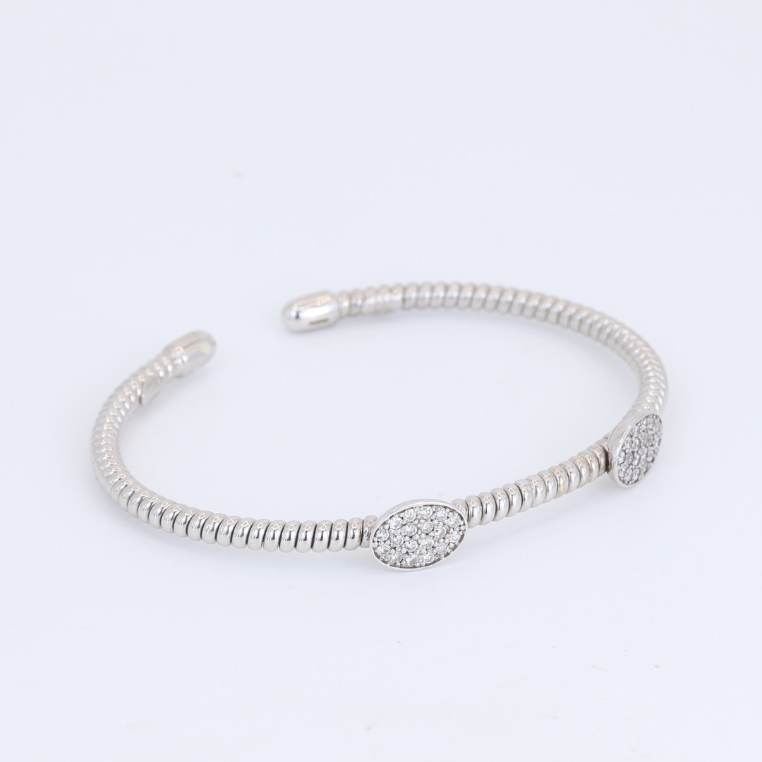 18CT DIAMOND SET BANGLE.