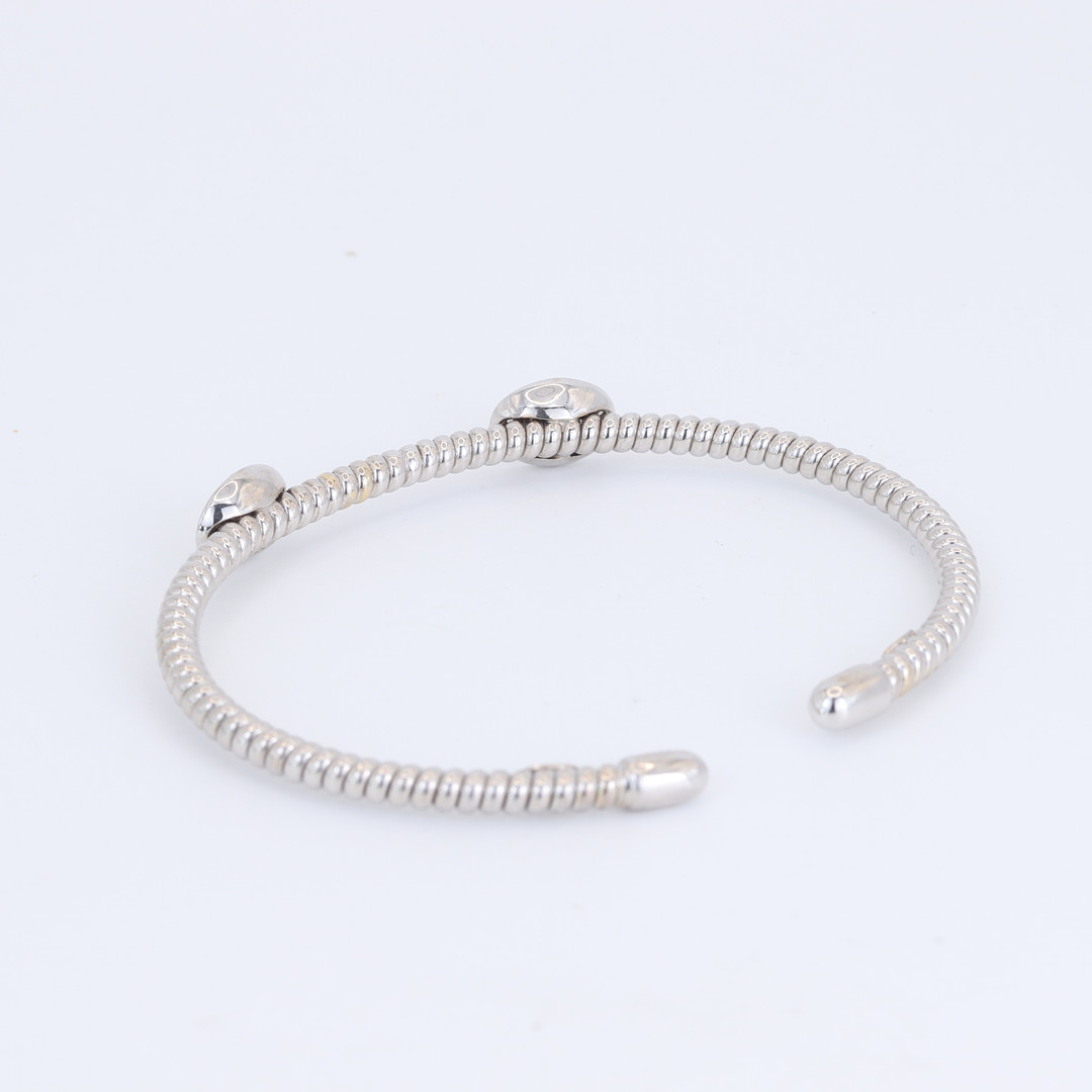 18CT DIAMOND SET BANGLE.