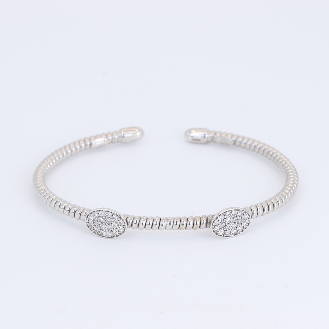 18CT DIAMOND SET BANGLE.