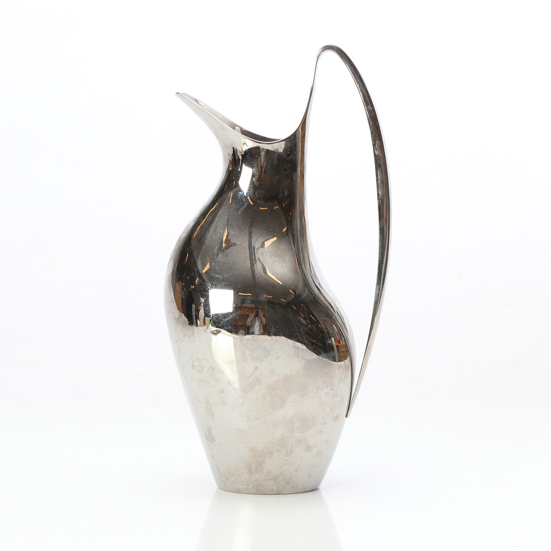 HENNING KOPPEL. KANNA. Rostfritt stål. Georg Jensen. Samtida tillverkning.