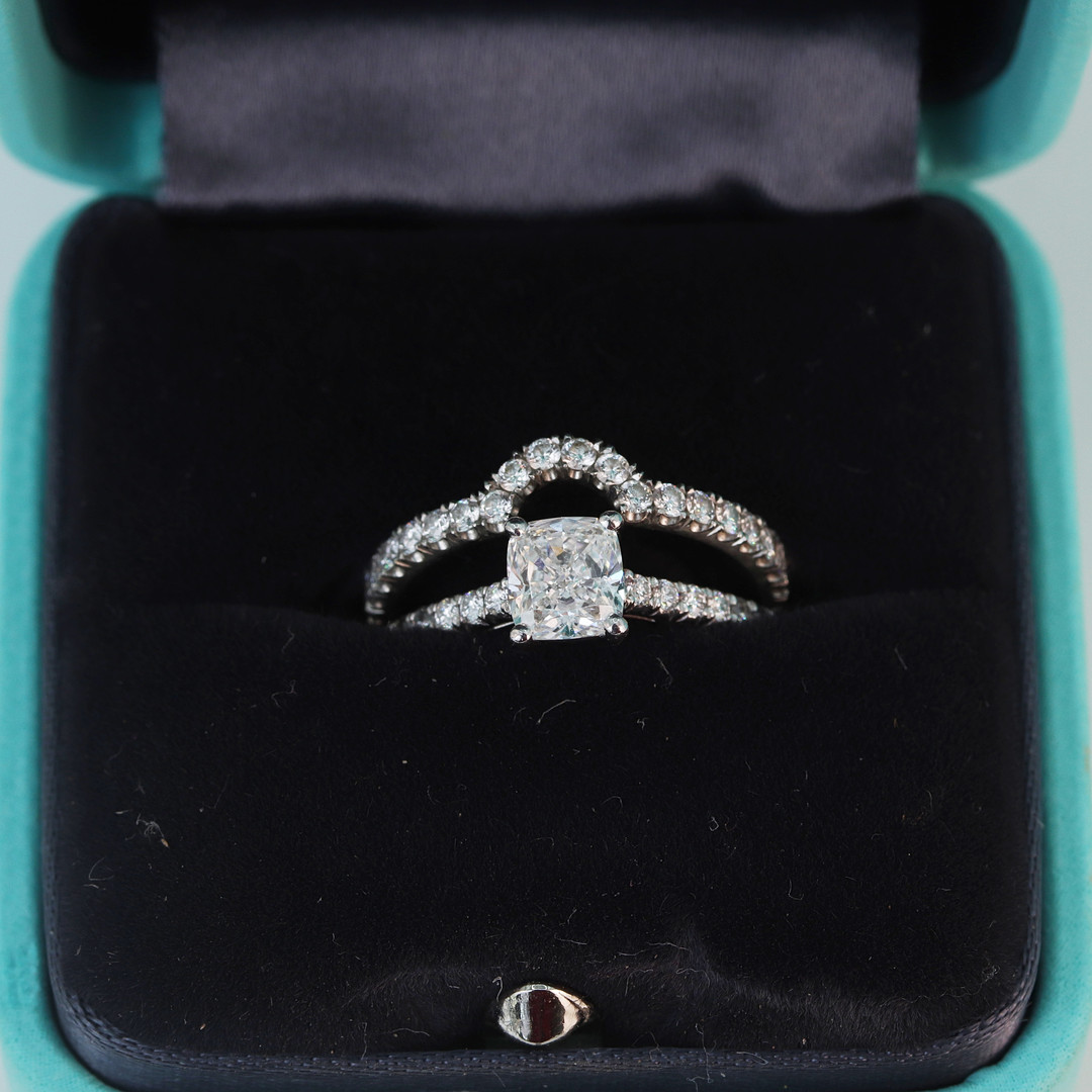 PLATINUM TIFFANY DIAMOND RING AND CAMPANION.