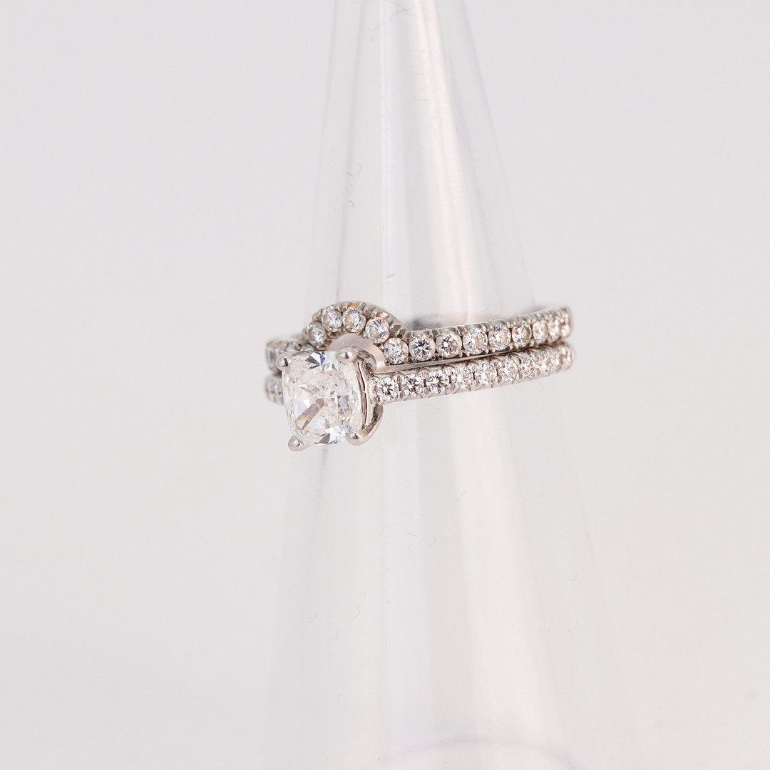 PLATINUM TIFFANY DIAMOND RING AND CAMPANION.
